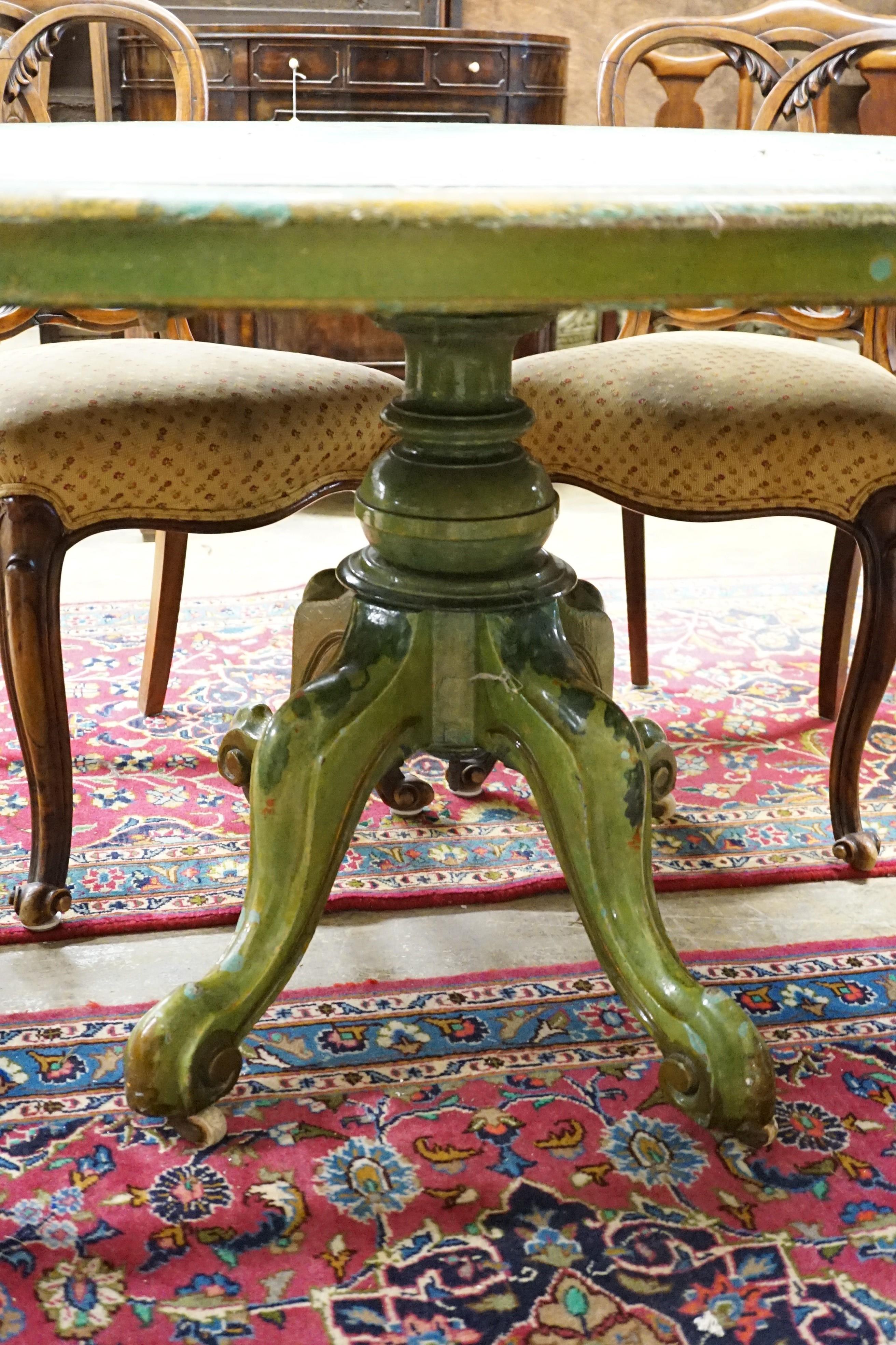 A Victorian breakfast table later painted green with floral decoration, length 143cm, depth 102cm, height 73cm
